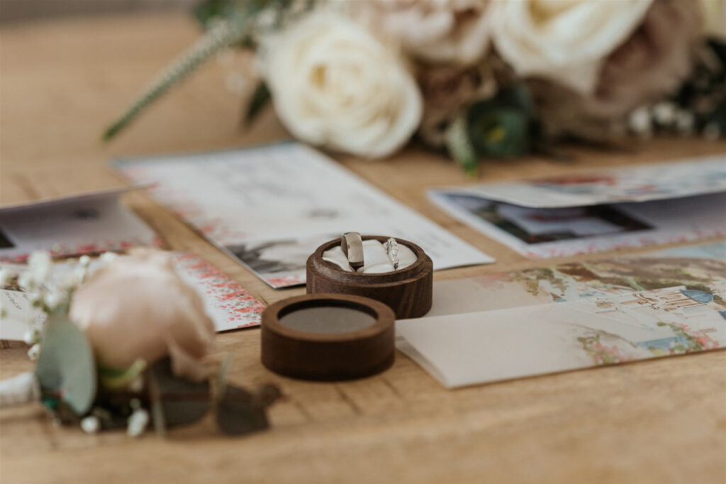 Wedding details with Wedding rings on a wooden table